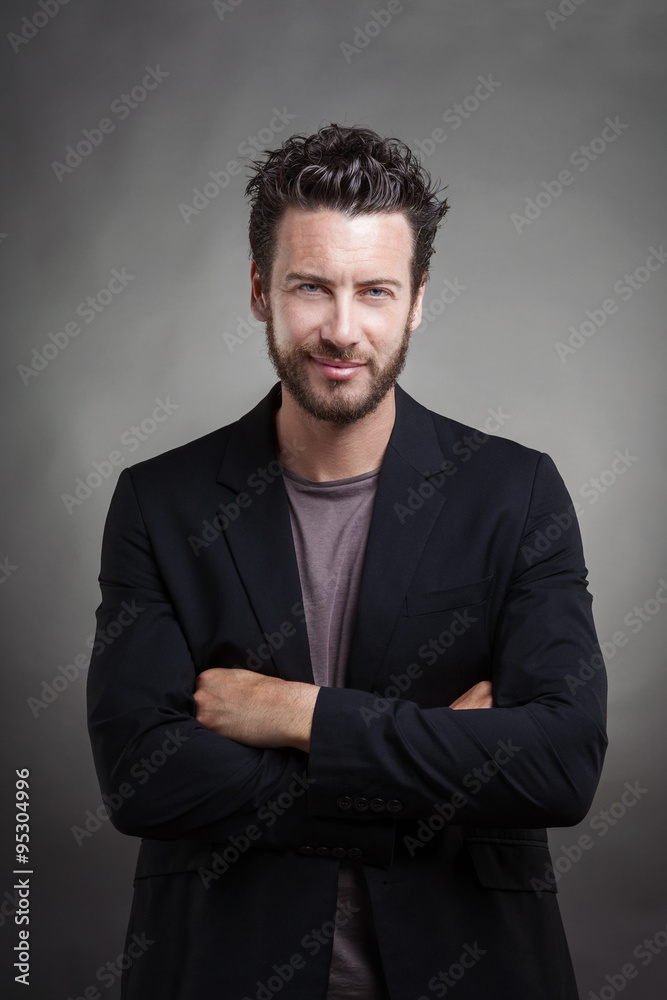 Handsome smiling man wearing grey suit Handsome smiling man wearing grey suit