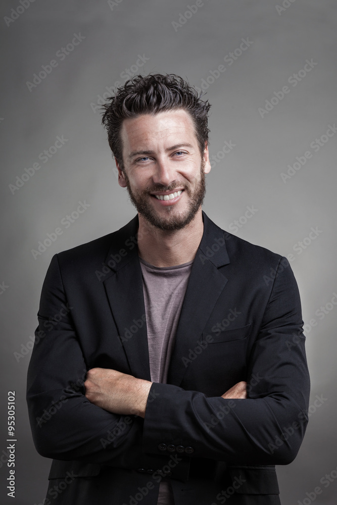 Handsome smiling man smiling wearing grey suit Handsome smiling man smiling wearing grey suit