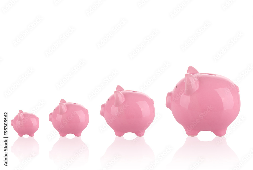 Saving money concept - Growing savings . Different sizes of piggy banks.