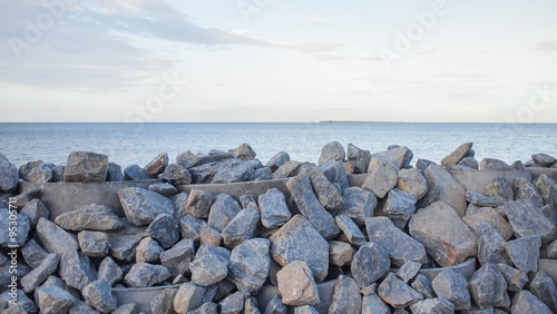 Stone embankment to prevent the waves of the sea.