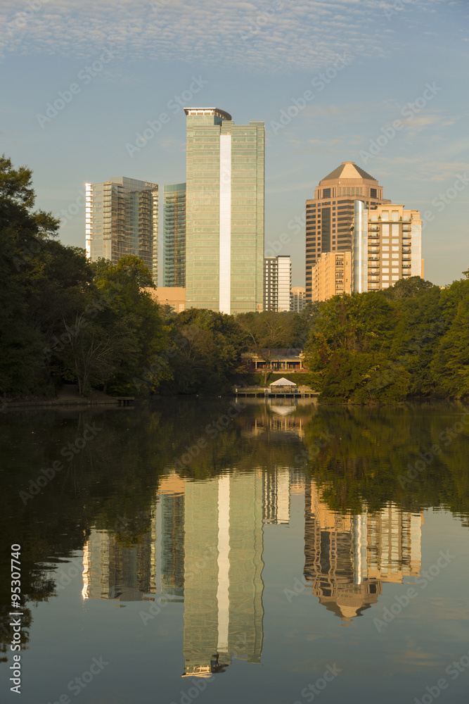 Atlanta skyline with water reflections from Piedmont Park, USA