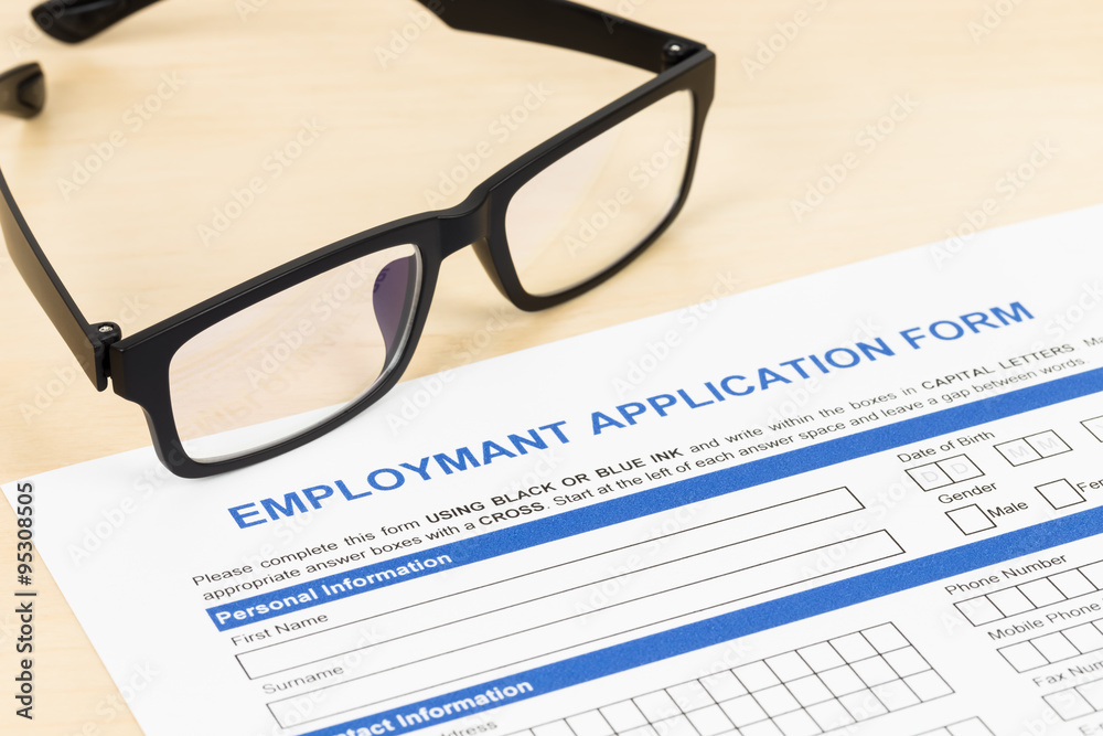 Employment application form with glasses concept job applying Employment application form with glasses concept job applying