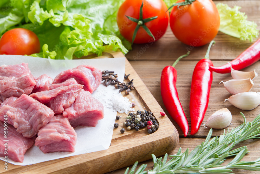 Raw, fresh beef with vegetables