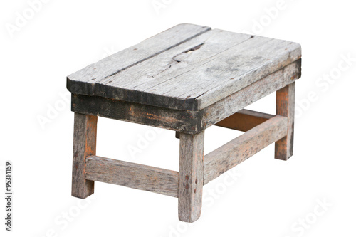 Old wooden stool isolated on white background.