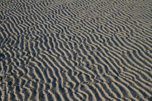 Patterns in the sand at the beach in thailand