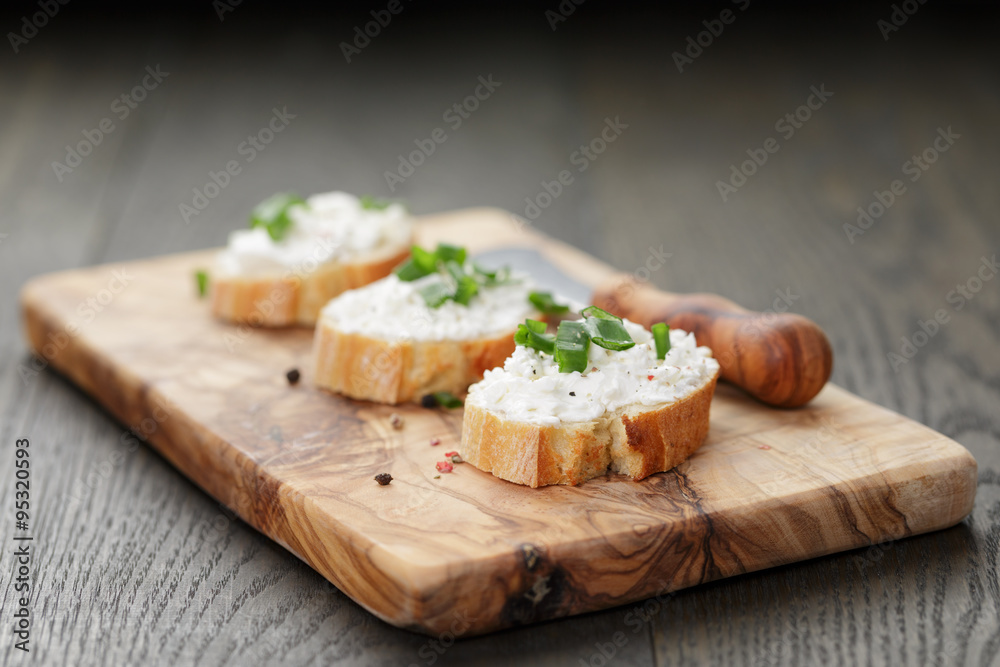 crunchy baguette slices with cream cheese and green onion crunchy baguette slices with cream cheese and green onion