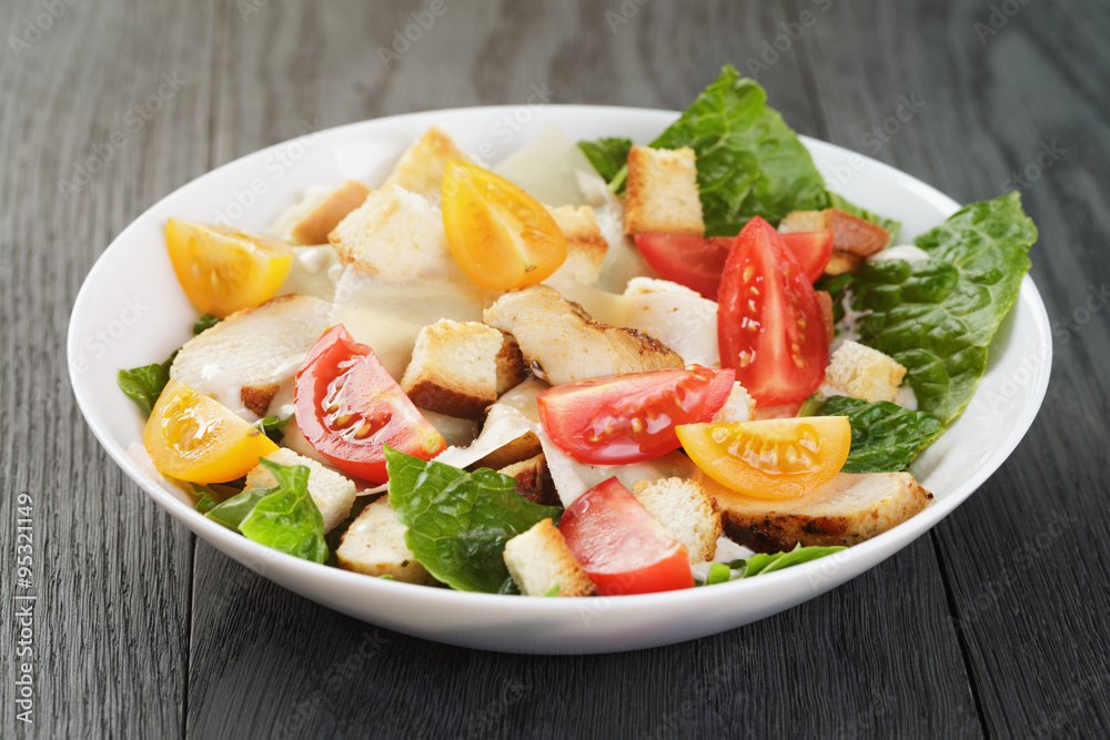 caesar salad with chiken fillet and different color tomatoes caesar salad with chiken fillet and different color tomatoes
