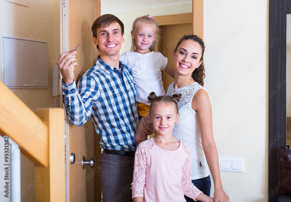 family standing at doorway