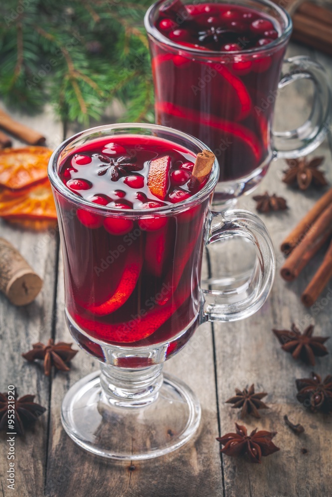 Homemade mulled wine with orange slices, cranberries, cinnamon and anise Homemade mulled wine with orange slices, cranberries, cinnamon and anise