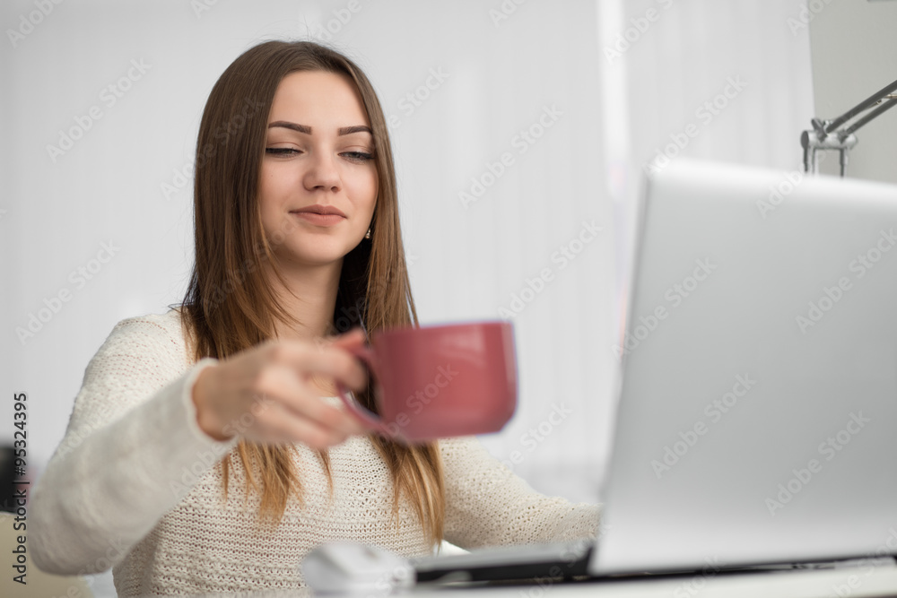 Young office worker sitting at her workstation. She make break. Young office worker sitting at her workstation. She make break.