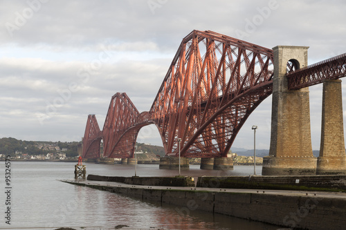 A pier and bridge with some stone pillars 