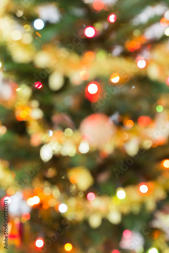 blur light celebration on christmas tree