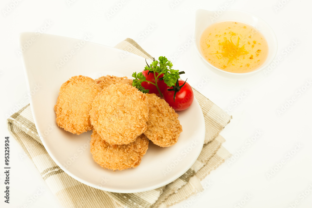 Fried coated cutlets with cherry tomatoes in a bowl Fried coated cutlets with cherry tomatoes in a bowl