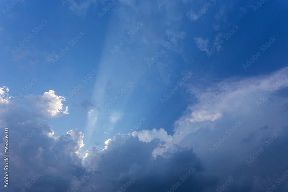 sun beam in blue sky with clouds background sun beam in blue sky with clouds background