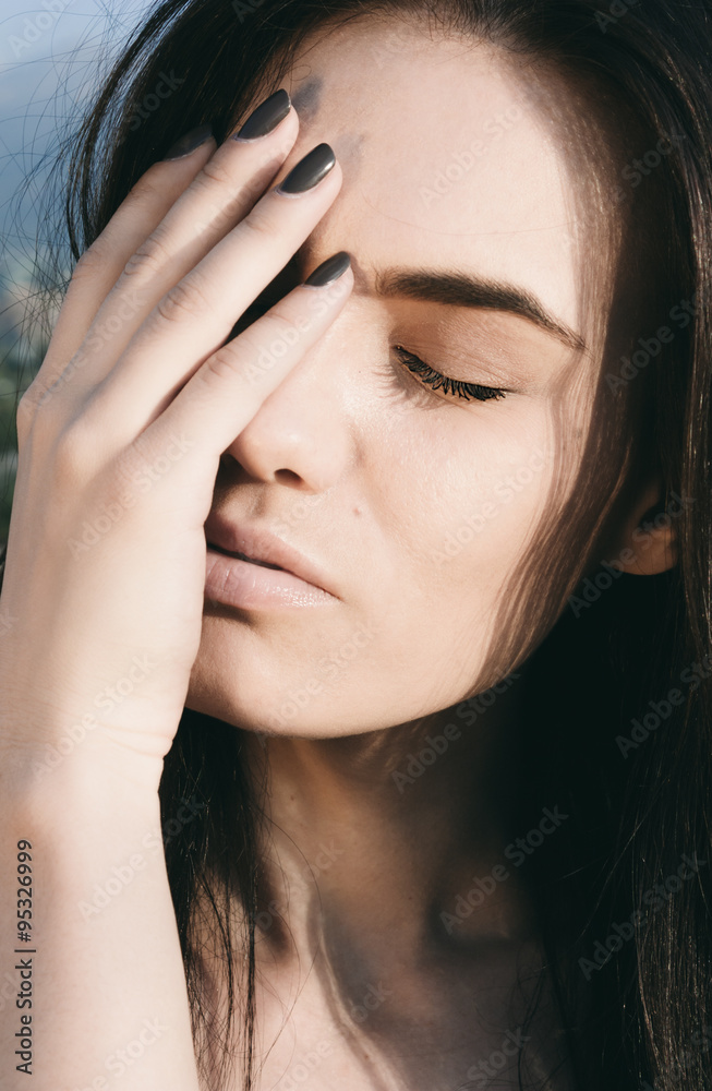 Fototapeta premium Thoughtful Woman Covering Half Face with Hand