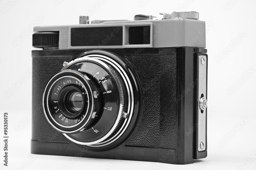 Old retro camera isolated on white