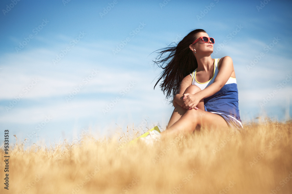 Freedom concept. Beautiful woman enjoying summer sun in the fiel Freedom concept. Beautiful woman enjoying summer sun in the fiel