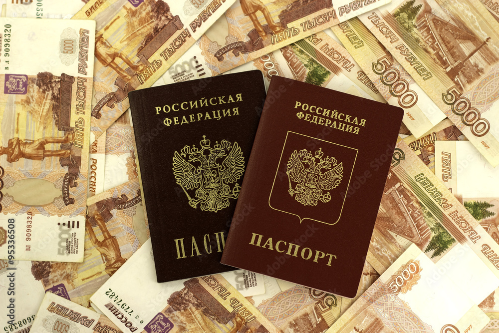 Russian foreign and domestic passport on a background of money Russian foreign and domestic passport on a background of money