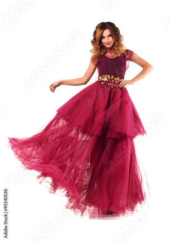 Young beautiful woman model in fairy red marsala dress. Isolated on white background.