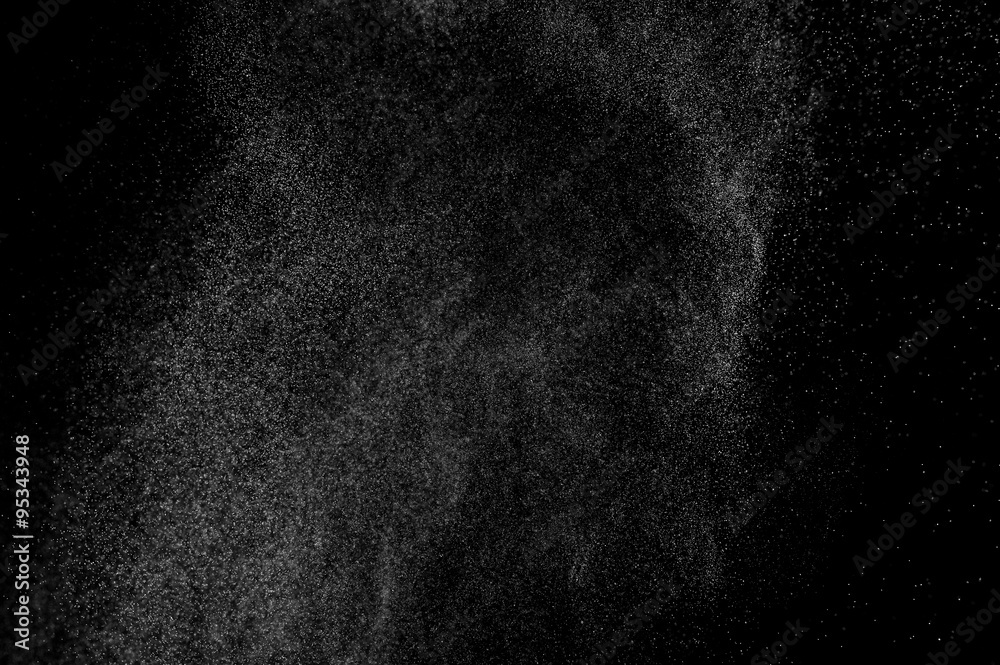 abstract splashes of water on a black background. splashes of milk. abstract spray of water. abstract rain. shower water drops.  white dust explosion. abstract texture. abstract black background.