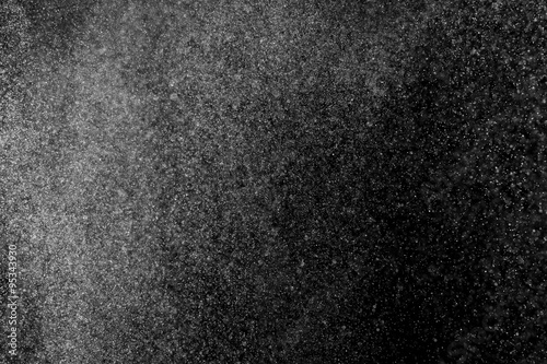 abstract splashes of water on a black background. splashes of milk. abstract spray of water. abstract rain. shower water drops. white dust explosion. abstract texture. abstract black background.