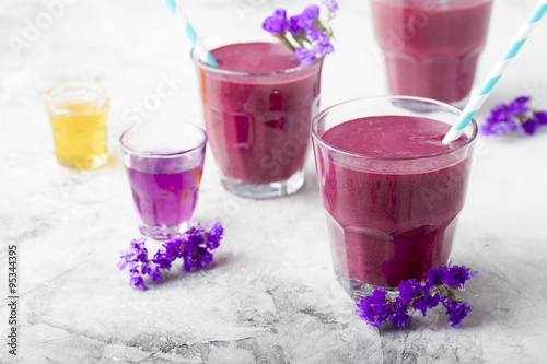 Blueberry, blackberry, honeysuckle, honeyberry smoothie with violet syrup and acai. 