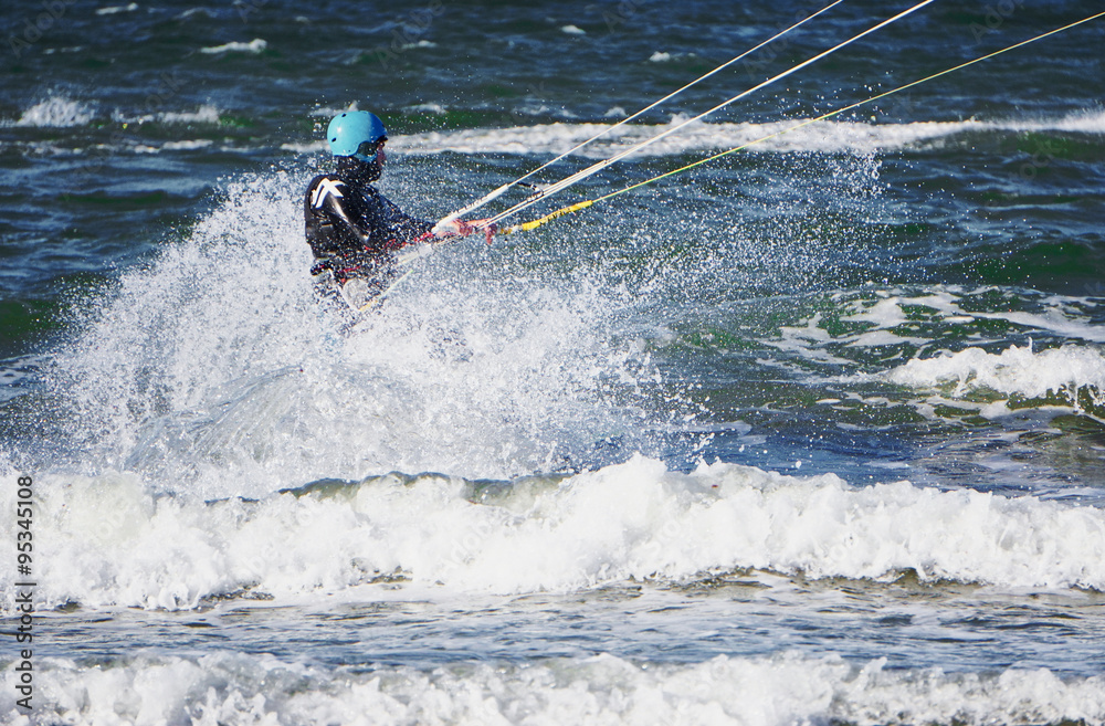 Obraz premium a kitesurfer at the beach of Warnemünde
