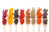 collection of spices on spoons, isolated background