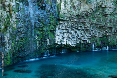 Fototapeta Naklejka Na Ścianę i Meble -  Ogawa falls, a beautiful sacred waterfall surrounded by stunning basalt cliffs in Kagoshima, Japan