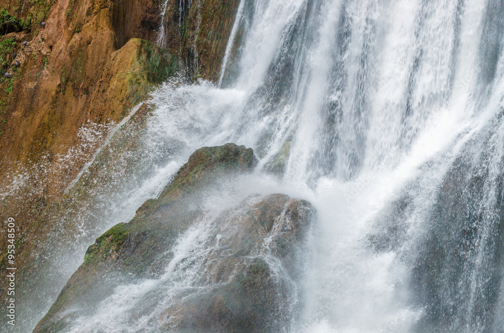 Fototapeta premium Waterfall close up water drops on rock