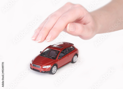 toy car covered with female hand