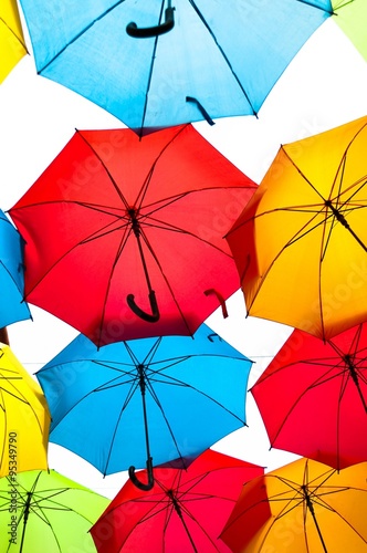 Many colorful umbrellas against the sky in city settings. Kosice  Slovakia. Color background