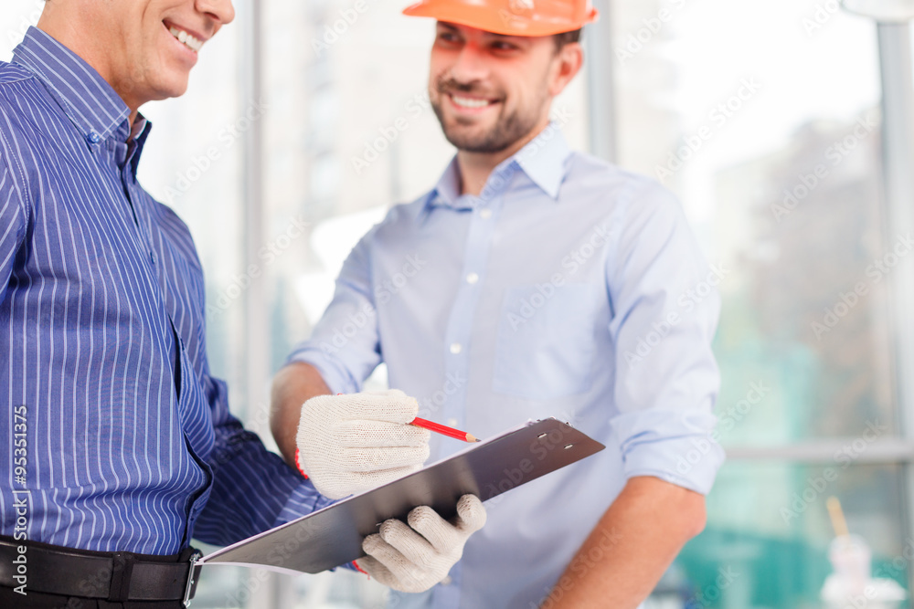 Experienced male engineers is discussing the construction Experienced male engineers is discussing the construction
