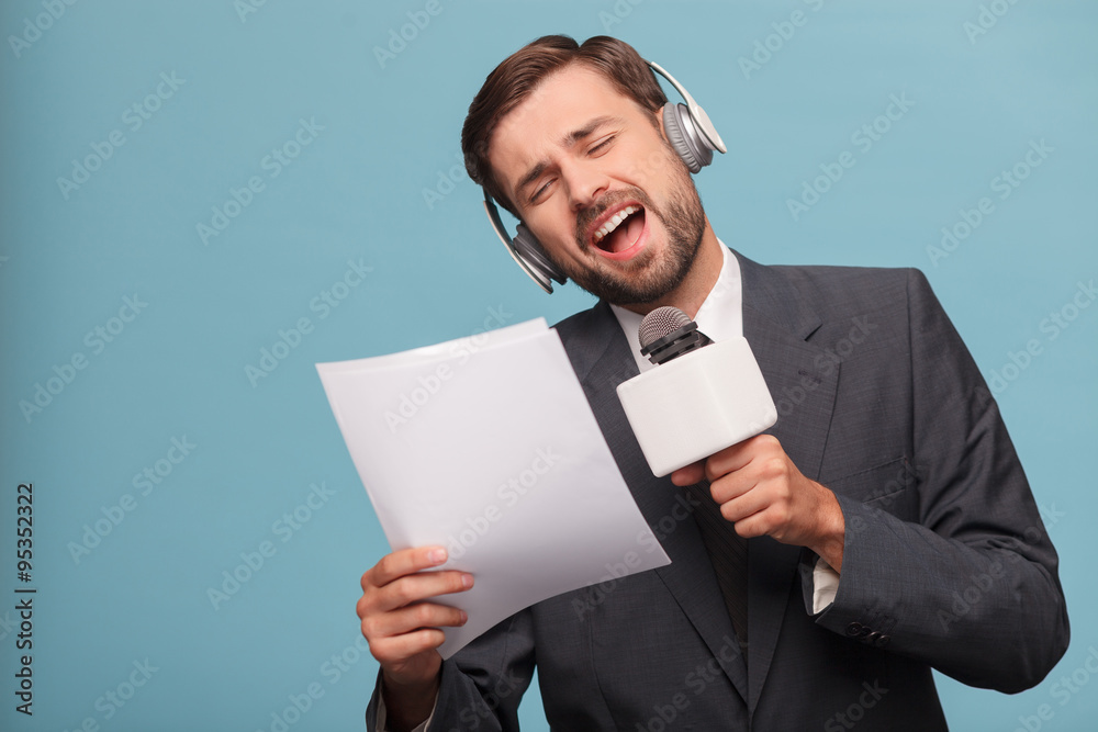 Attractive male reporter is making fun at studio Attractive male reporter is making fun at studio
