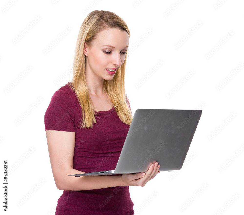 Caucasian woman read on the notebook computer Caucasian woman read on the notebook computer