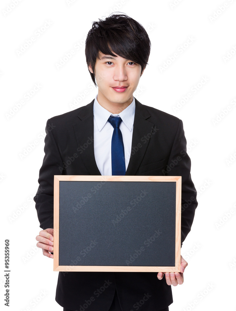 Young Businessman show with the blank chalkboard Young Businessman show with the blank chalkboard