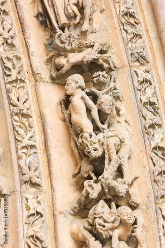 Sculptures of People and Devils in Hell in the Cathedral of Leon