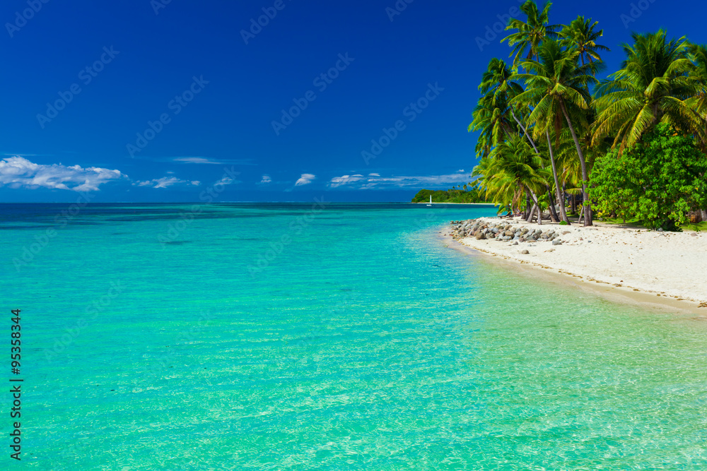Fiji island with sandy beach and clear lagoon water