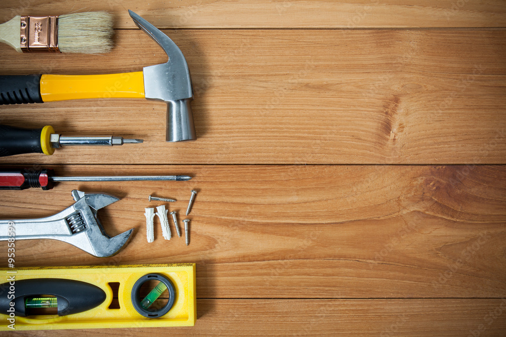 Closeup of assorted work tools on wood Closeup of assorted work tools on wood