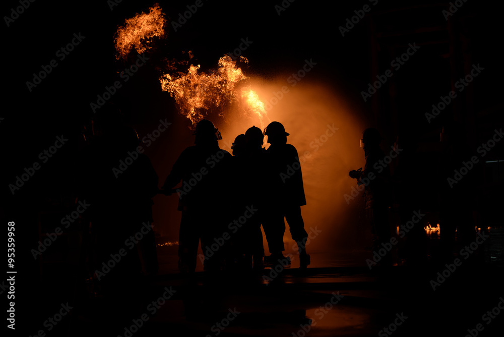 Firefighters fighting a fire.