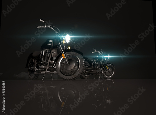 Two old vintage motorcycles on black background.