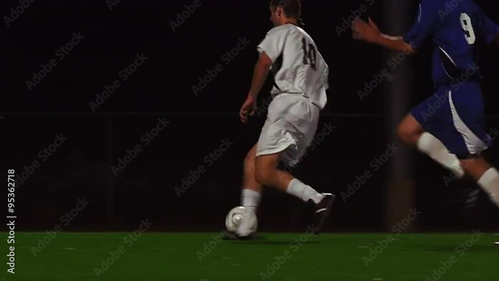 The camera pans with a soccer team as they score a goal
The camera pans with a soccer team as they score a goal