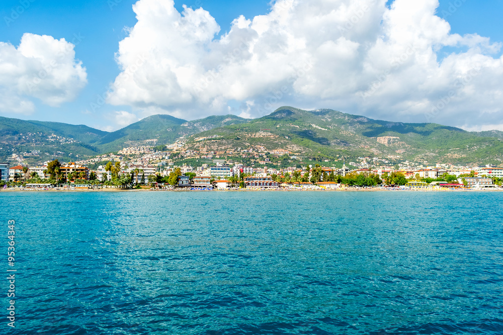 Sea and beautiful cityscape with clouds in Alanya, Turkey.