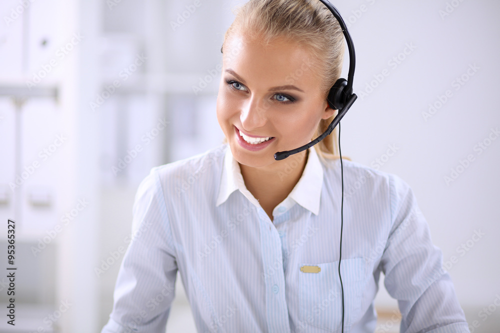 Close-up portrait of a customer service agent sitting at office Close-up portrait of a customer service agent sitting at office