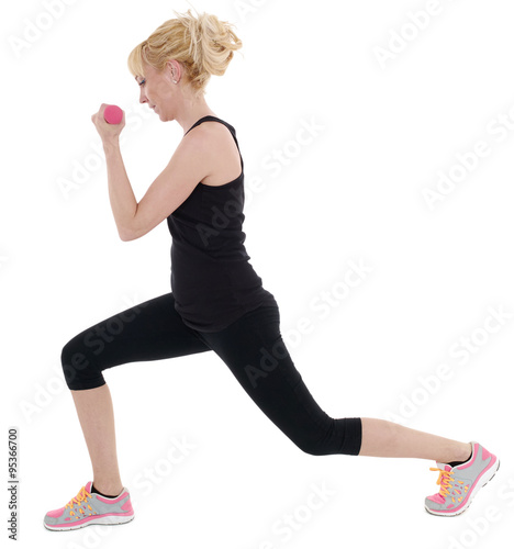 Sporty girl holding weights. Fitness gym concept.