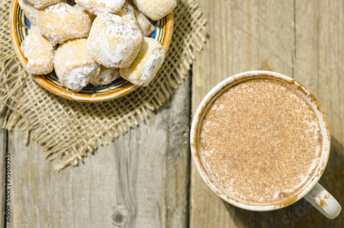 Hot chocolate and crescent rolls stuffed with walnut and powder