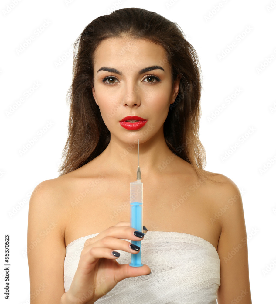 Young beautiful woman with a gauze bandage on her chest, holding syringe, isolated on white Young beautiful woman with a gauze bandage on her chest, holding syringe, isolated on white