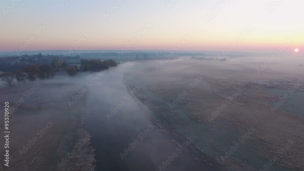 Aerial view of sunset above foggy riverside Aerial view of sunset above foggy riverside