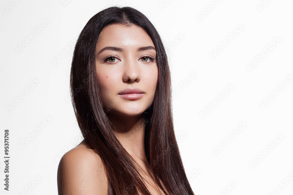 Naklejka premium Woman with beautiful hair and clean skin on a white background isolated