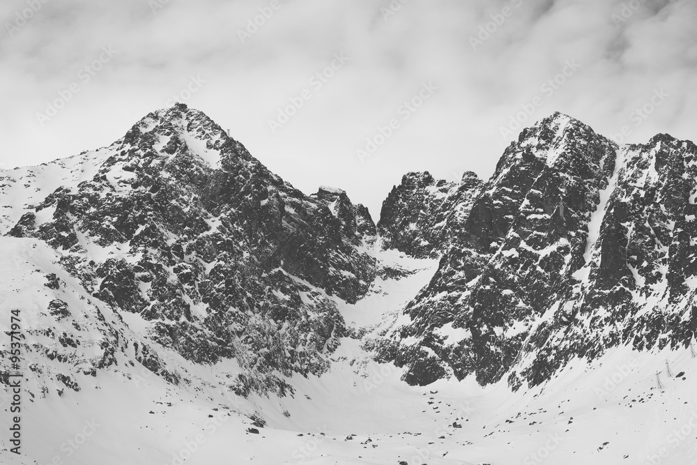 Vintage black and white photo os snow covered mountains